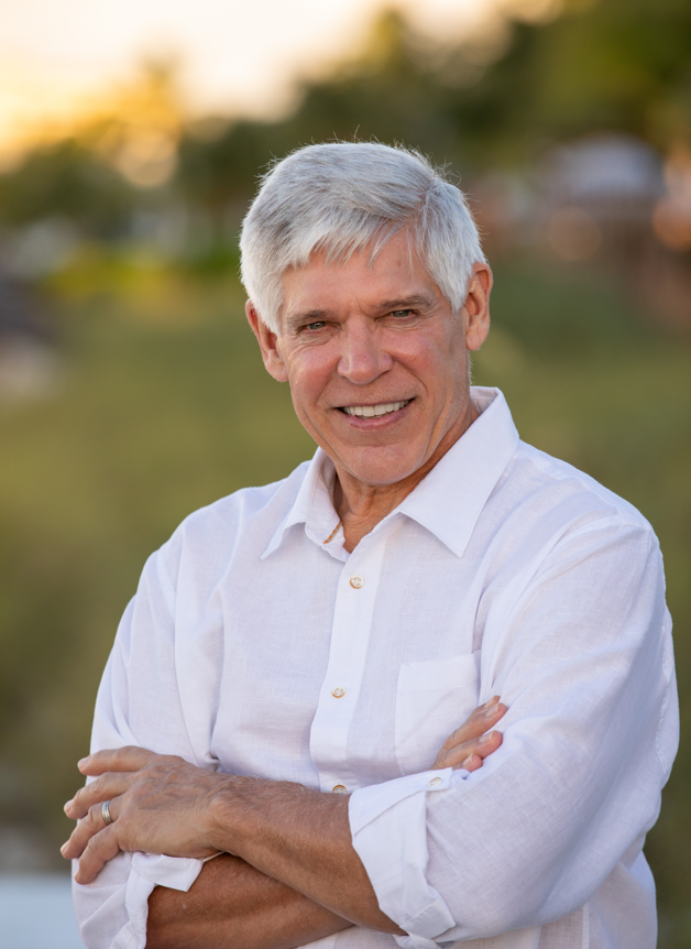 Dr. Paul Parker in white dress shirt outside