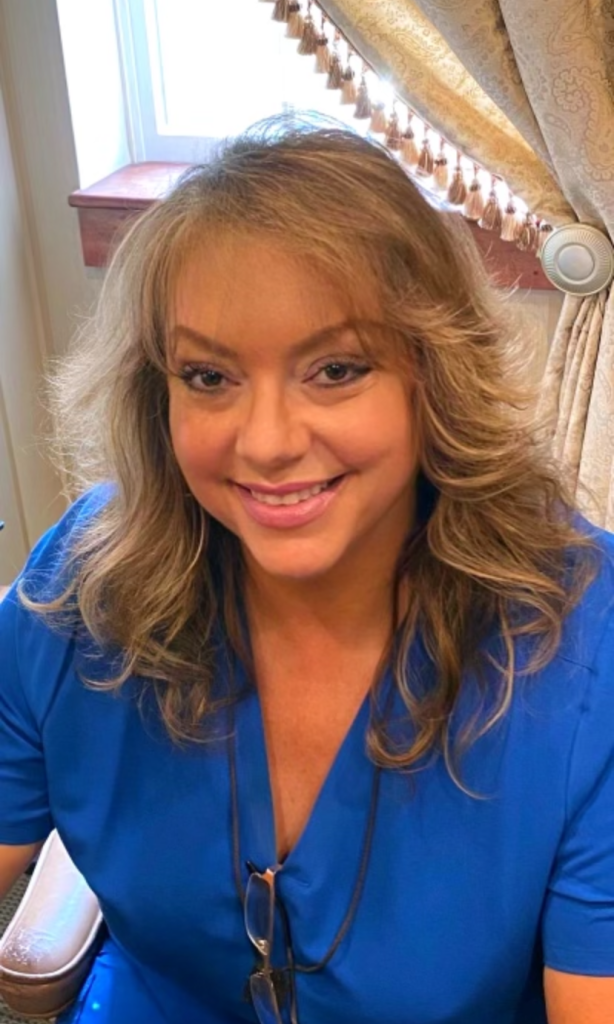 Gina Romeo at the Parker Center for Plastic Surgery in blue scrubs