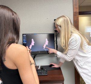 Stacie showing a patient their computer image